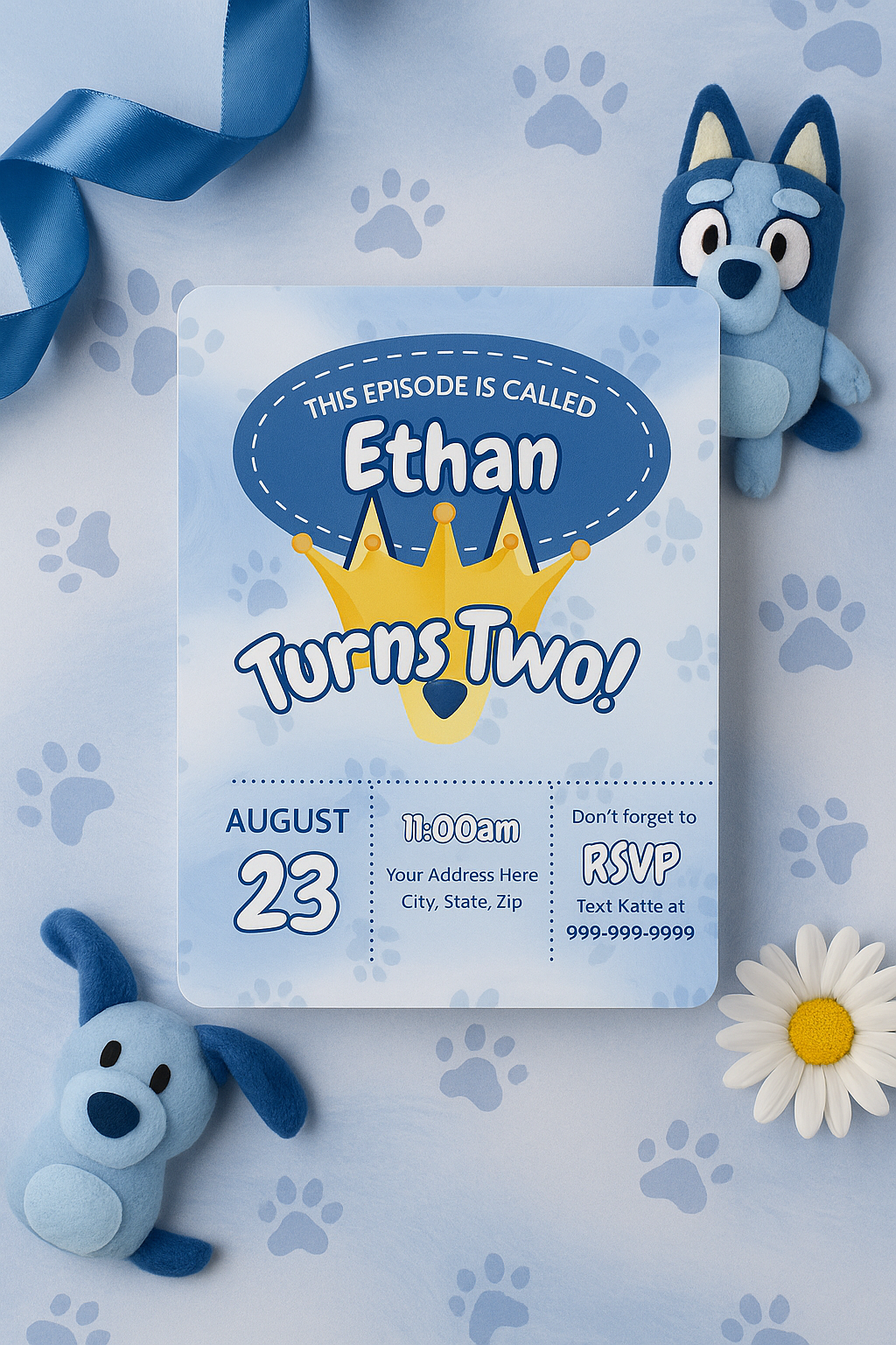 Flat lay of Bluey-themed 2nd birthday invitation for boys with crown, dog ears, paw prints, and bold blue design. Surrounded by Bluey plush toys, blue ribbon, daisies, and playful accents on a textured pastel blue background.